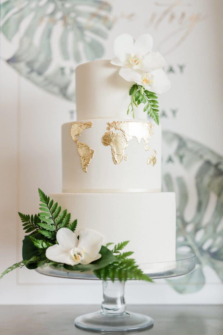 white-cake-with-gold-leaf-map