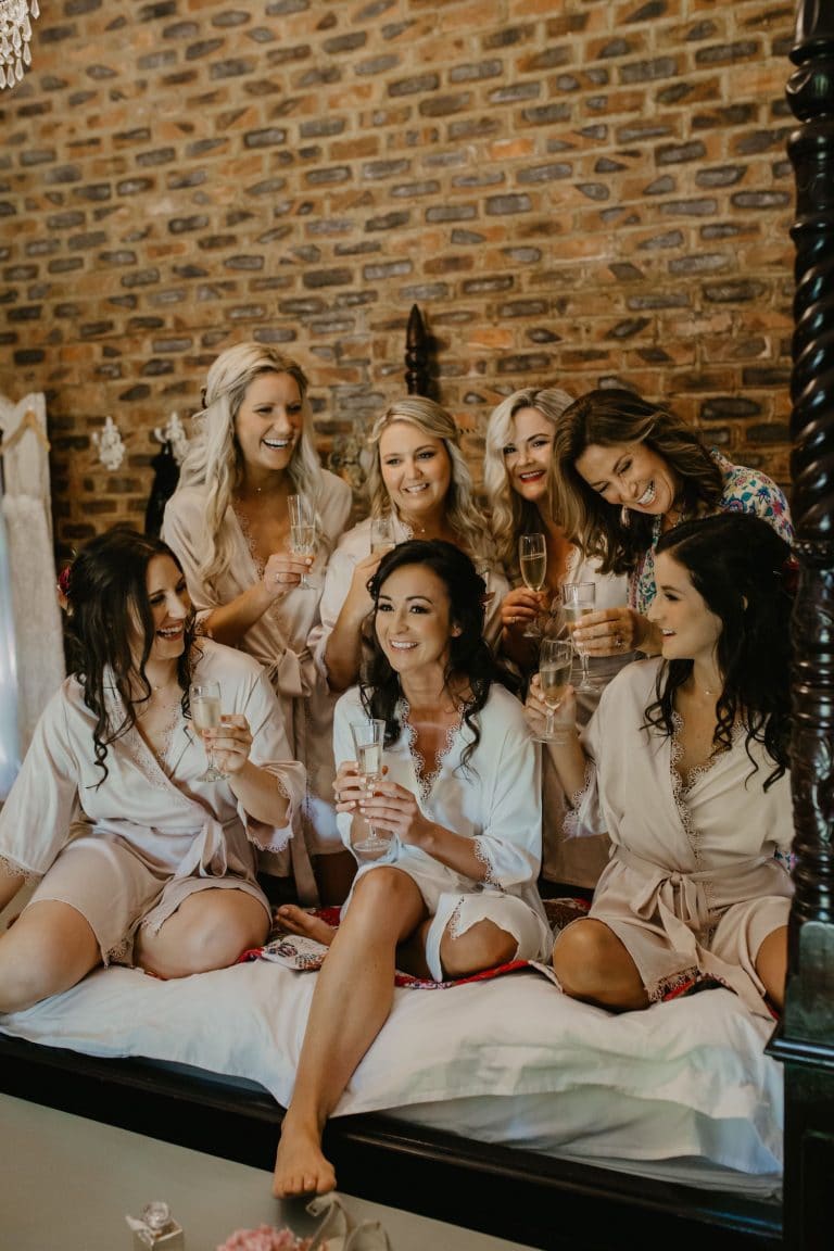 bridesmaids-getting-ready-with-champagne