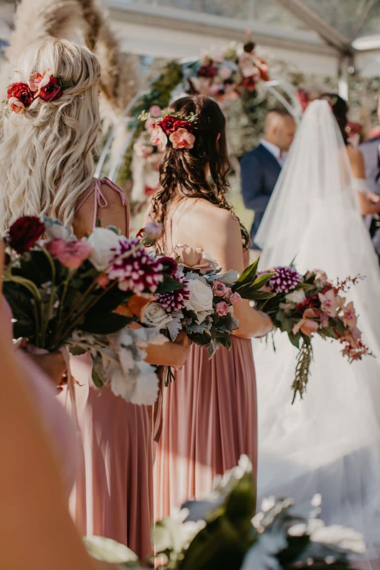bridesmaids-at-clear-marquee-wedding-ceremony