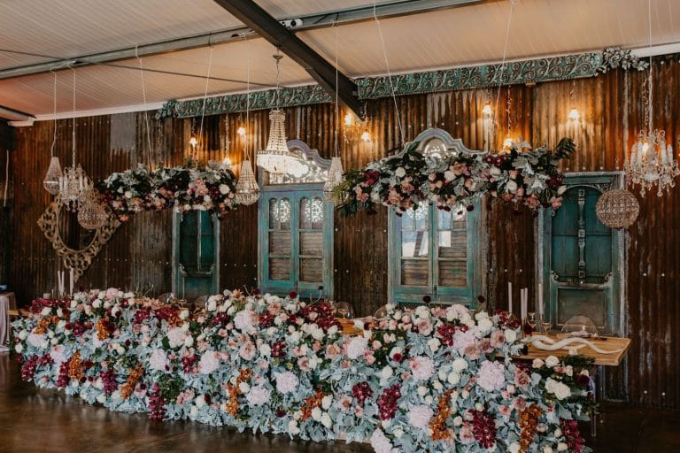 south-african-destination-wedding-main-table-with-abundant-florals