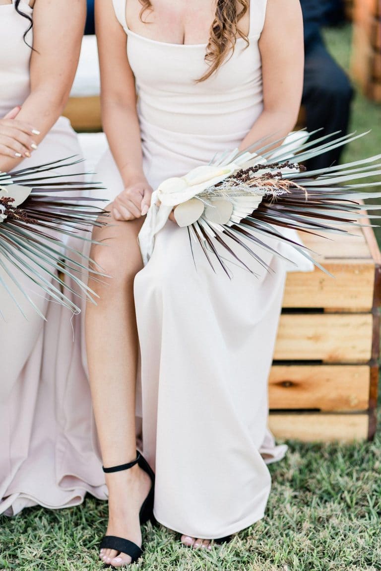 bridesmaids with palm fan bouquets