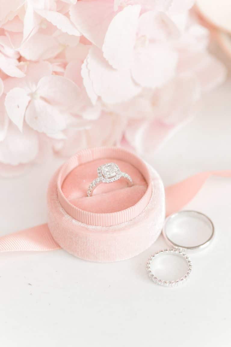 cushion cut halo engagement ring in pink velvet box