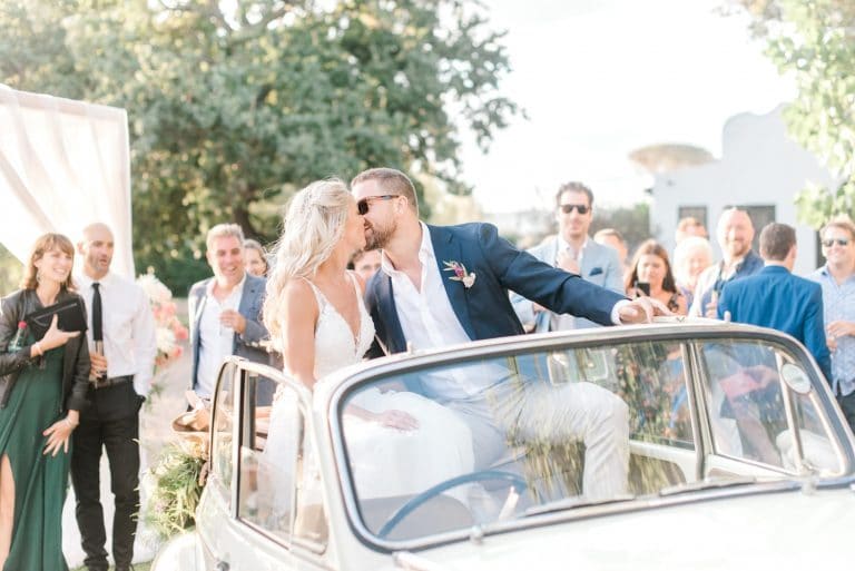 bride and groom with morris minor wedding car