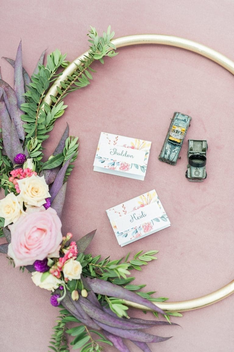 bridal hoop bouquet with floral place cards and toy cars