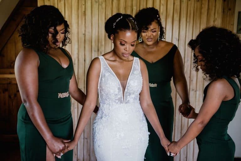 bride and bridesmaids prayer