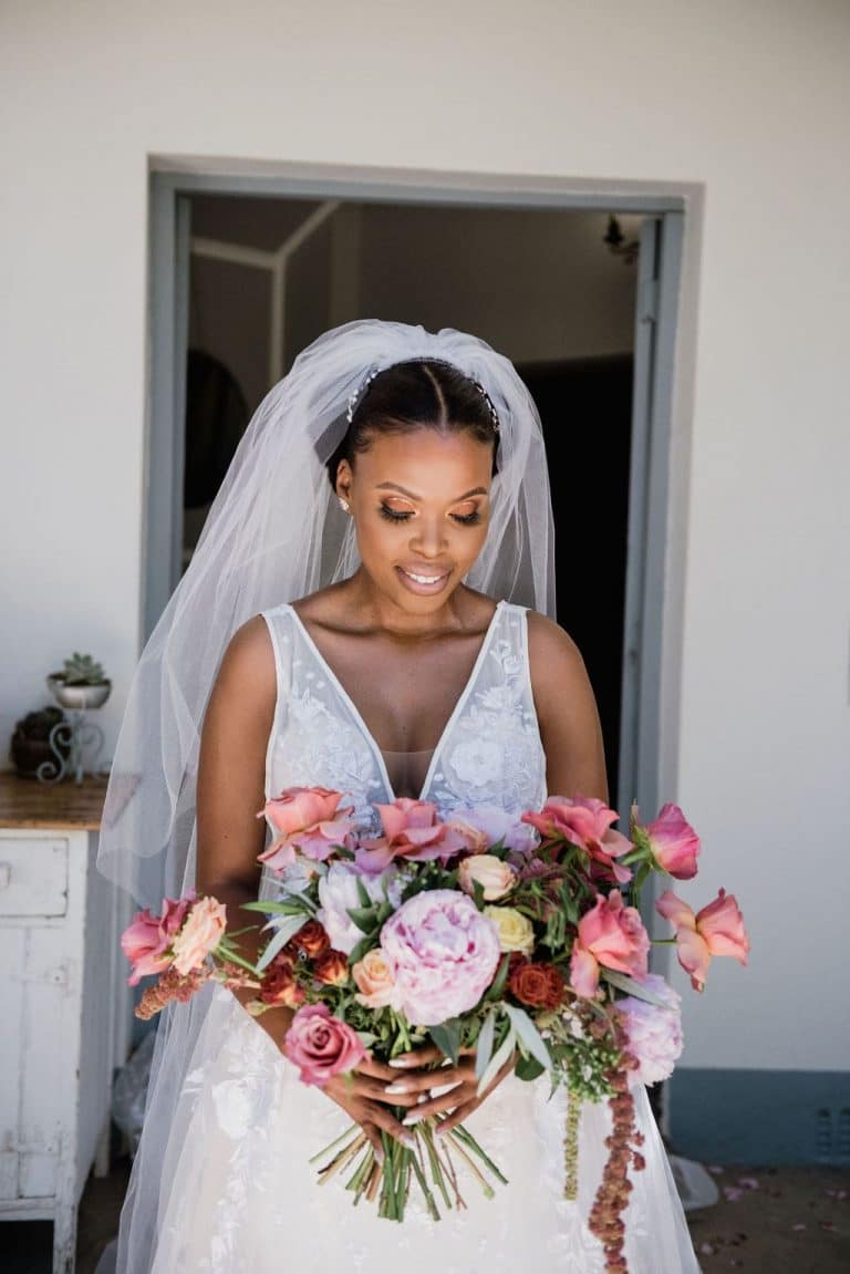 bride with rose and peony bouquet