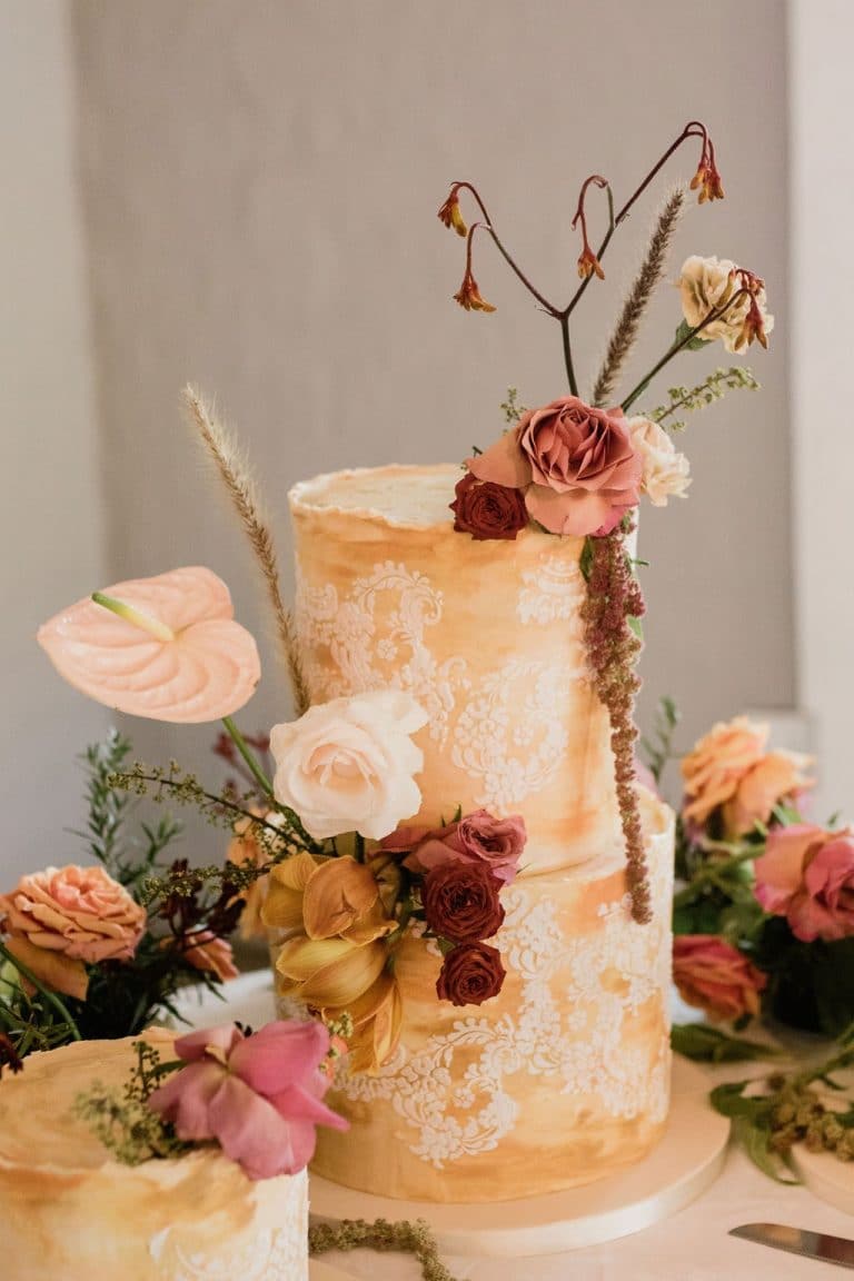 yellow wedding cakes with floral decoration