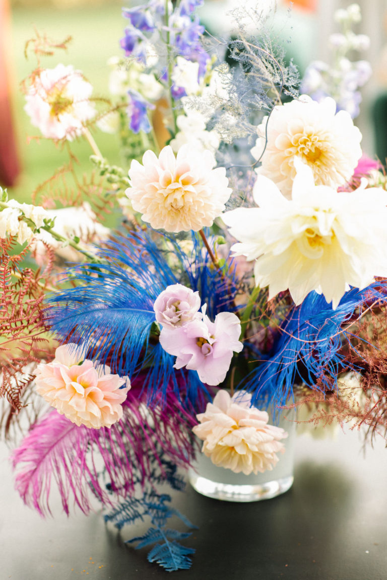 colourful flower and feather centrepiece