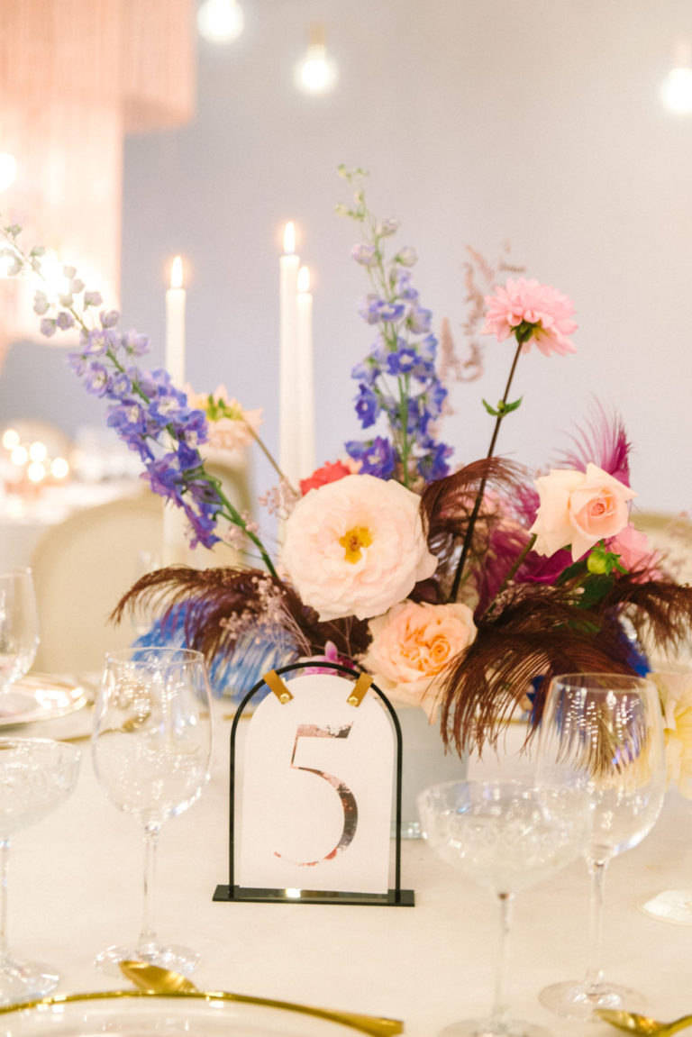 floral print table number and colourful centrepiece